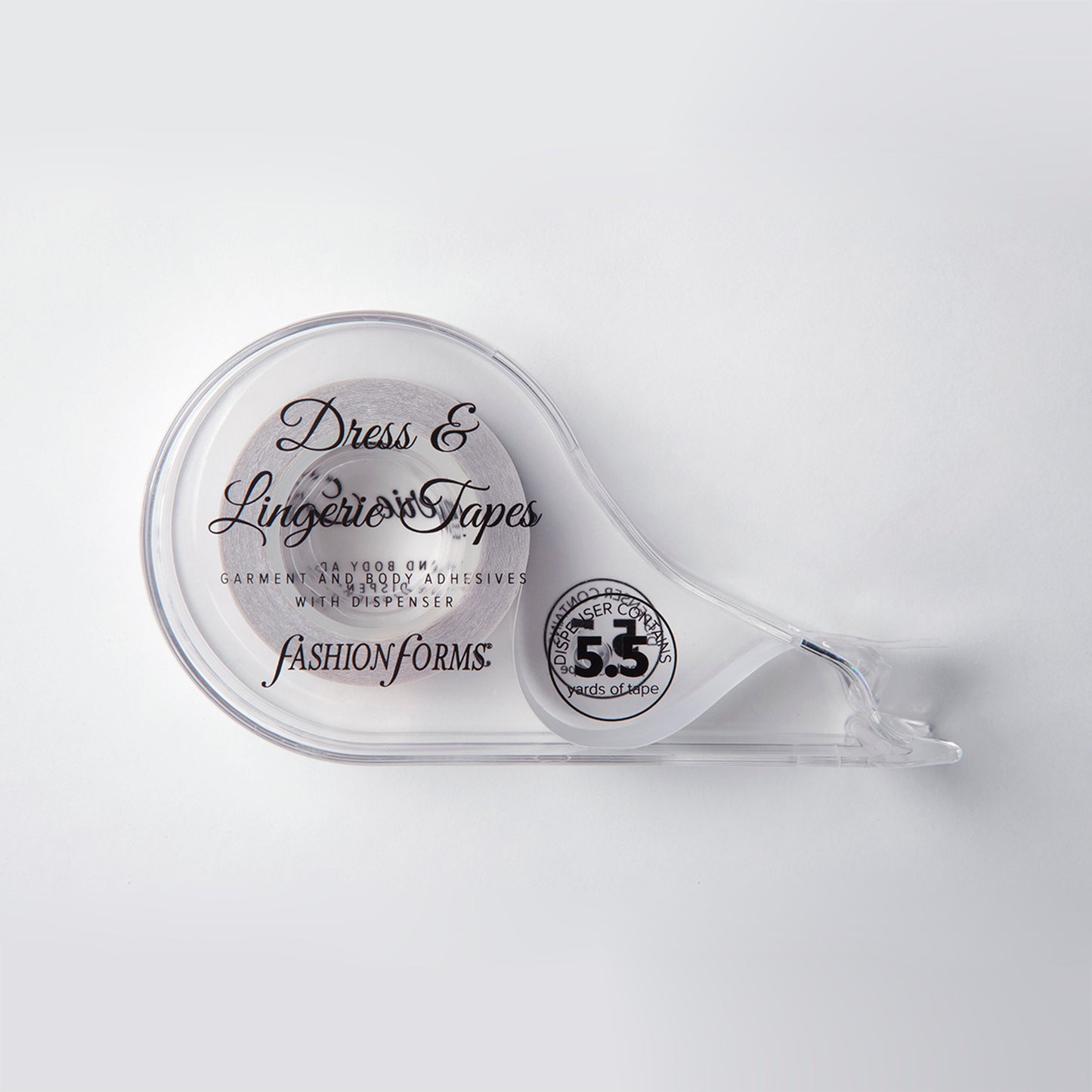 Close up product image of the dress tape dispenser. It is transparent and is shaped almost like a tear trop.