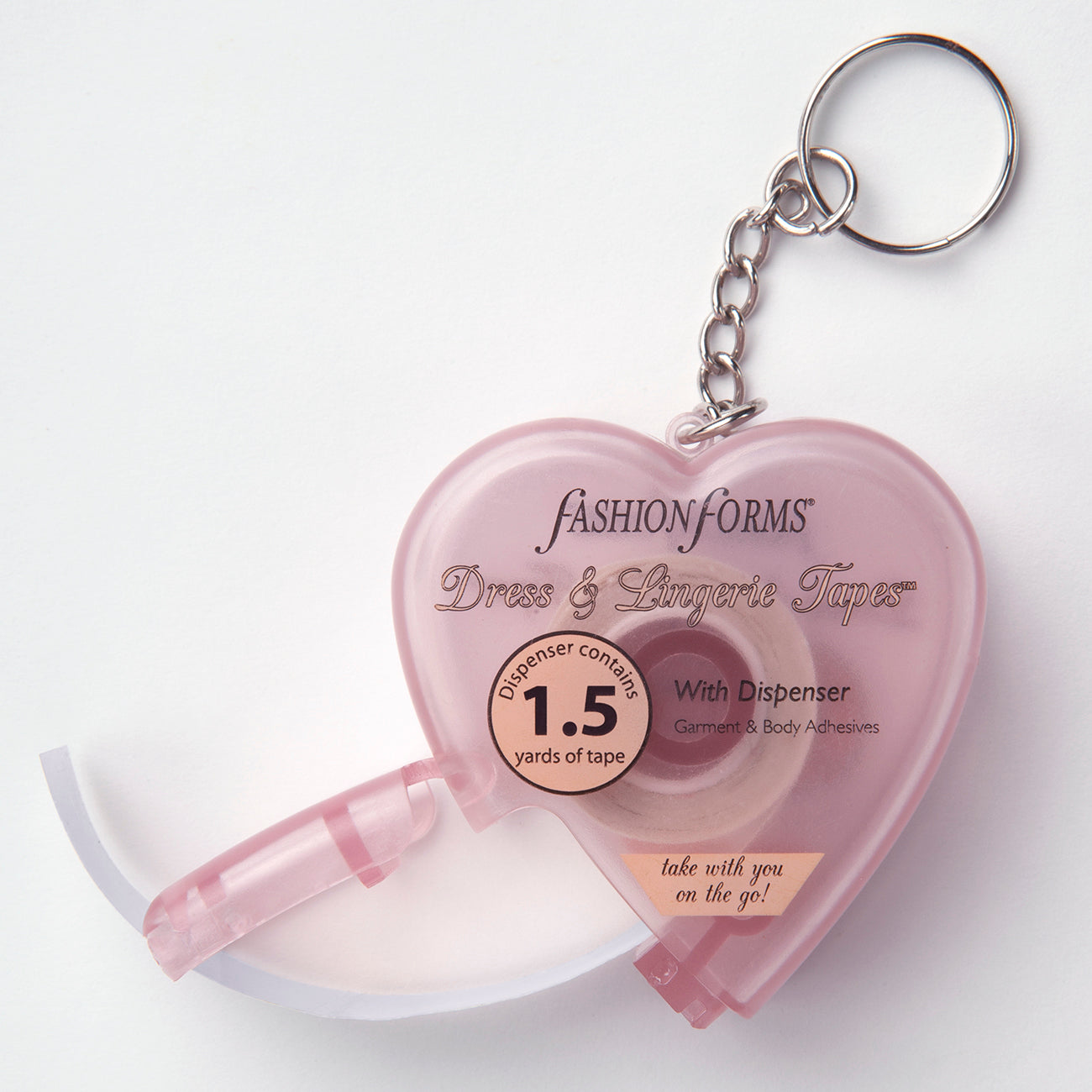 Product image of the pink keychain tape dispenser. It is in the shape of a heart and is small, perfect for on the go.