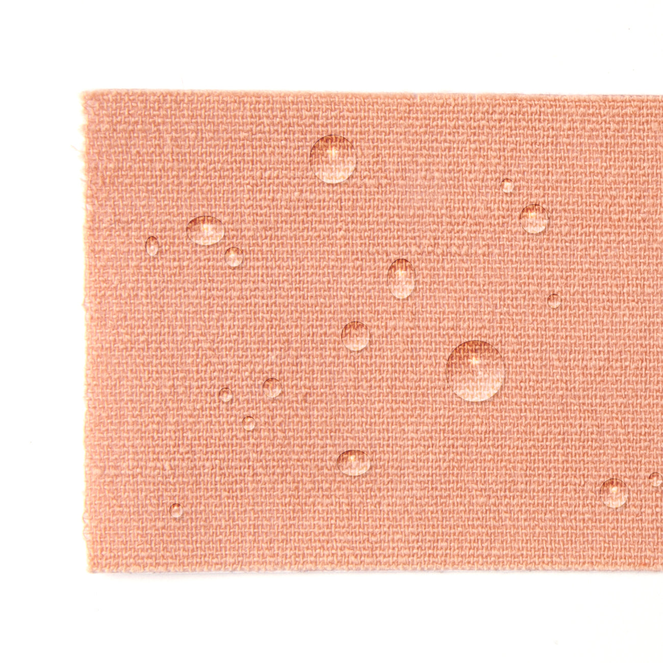 Close up of the tape showing the nude color, texture and how the outside is water resistant.