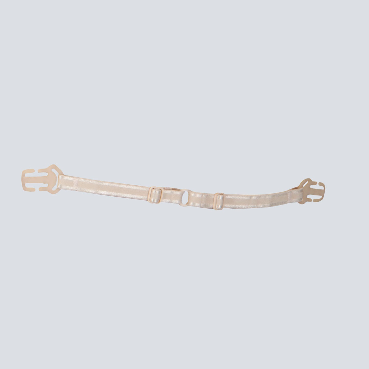 Strap Mate on its own, the product alone. It is beige, is adjustable and has hooks for your bra straps on either side.